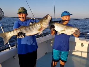 Chesapeake bay charter fishing kids catching rockfish